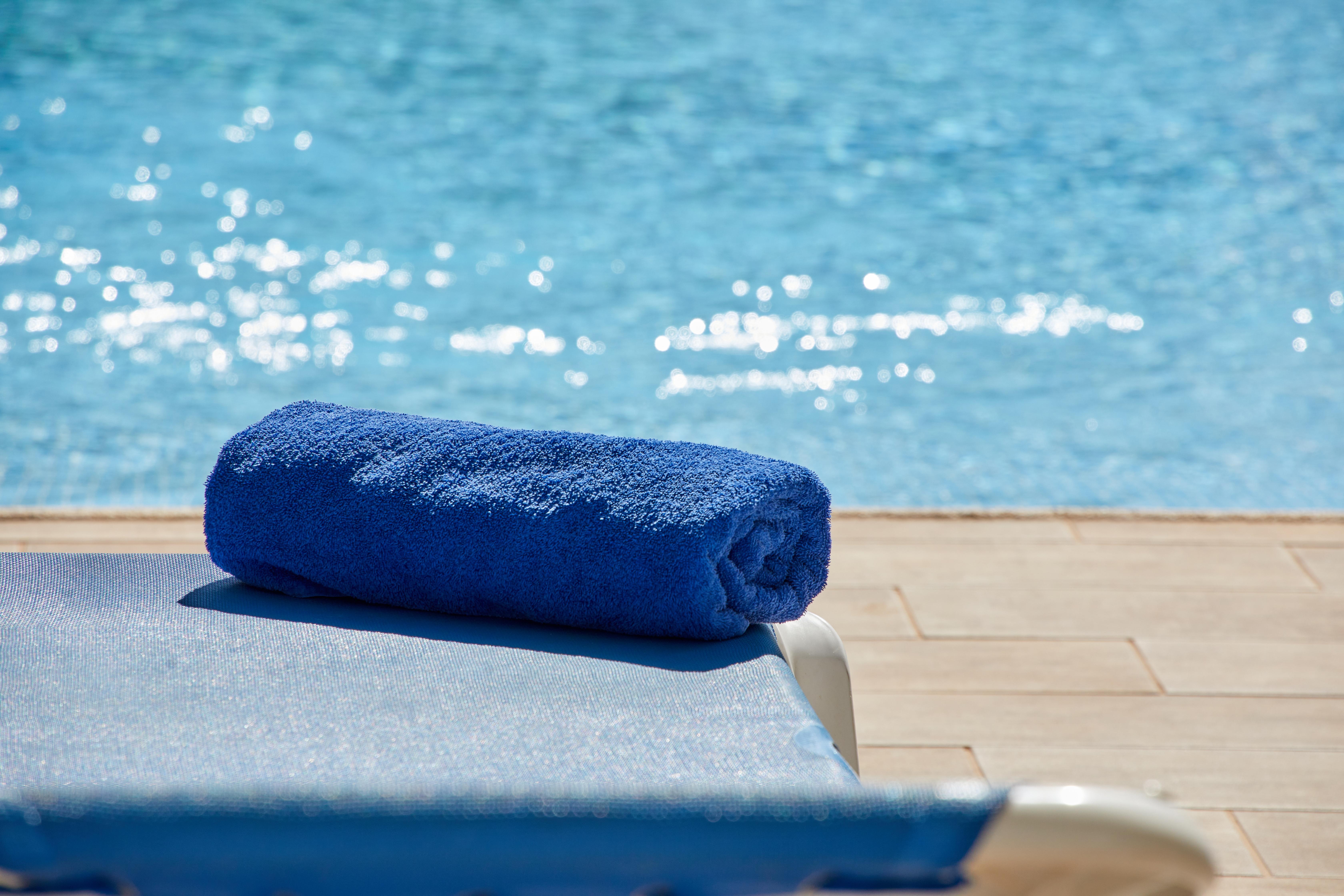 Hotel Joan Miro Museum Palma de Mallorca Exterior photo A blue towel on a beach chair.